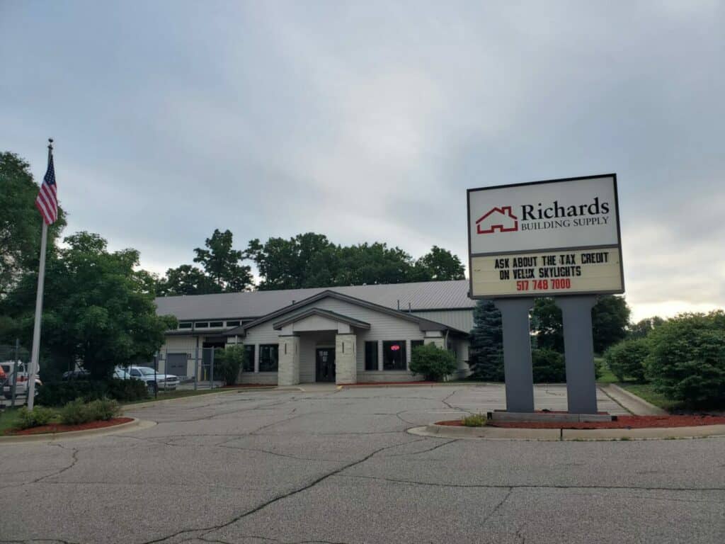 Richards Building Supply in Jackson, MI.  Single story, light brown brick and metal building.